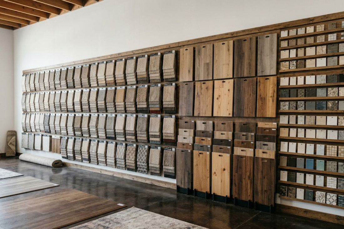 Flooring showroom wall rack with carpet, wood look plank, and tile samples